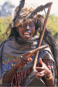 レソトの伝統楽器（マモコロン）を ひくバソトの女性